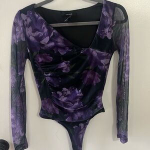 Black long sleeve bodysuit with purple flowers. Size S.